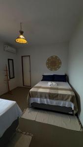 a bedroom with a large bed in a room at Pousada Raízzes in Amontada