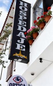 a sign for the eiffel tower on a building at Hospedaje Paris in Cusco