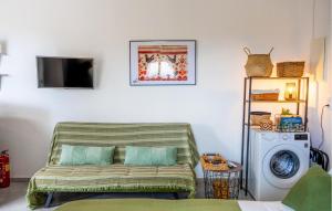 a living room with a couch and a washing machine at Prinos 3 in Agia Galini
