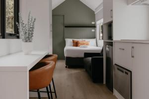 a room with a bedroom with a bed and a kitchen at Tasman Holiday Parks - Yallingup Beach in Yallingup