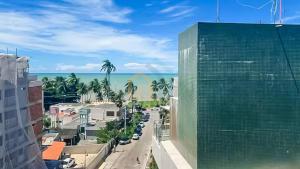 a view of the beach from a building at Mahalo Flat Cabo Branco Genius Flats in João Pessoa