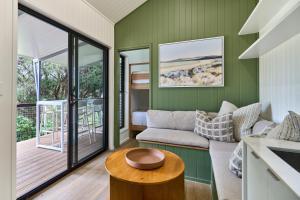 a living room with a couch and a table at Tasman Holiday Parks - Yallingup Beach in Yallingup