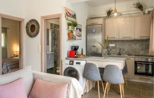 a kitchen with a table and chairs in a room at Thyme 1 in Agia Galini