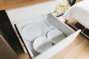 a white drawer with two wine glasses in it at Pinelight Retreat in Kuei-chu-lin +11 photos