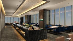 a buffet line in a restaurant with tables and chairs at Village Atami in Atami +19 photos