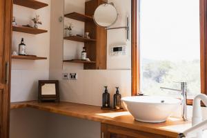 a bathroom with a sink and a window at Miramar Beach House in Seymour +60 photos