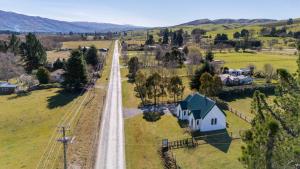 an aerial view of a country road with a house at The Church Millers Flat in Millers Flat