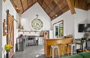 a kitchen with a counter and a cross on the wall at The Church Millers Flat in Millers Flat