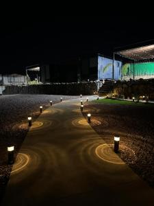 a row of lights on a road at night at cabañas aldebaran in Ciénega Redonda