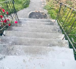 a set of concrete stairs with a metal gate at Surrey central in Surrey