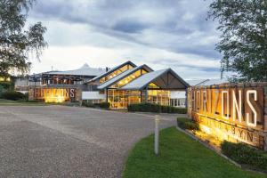 a large building with a sign in front of it at Horizons 306 - Deluxe Lake Front Studio l Pool l Tennis l WiFi l BBQ in Jindabyne