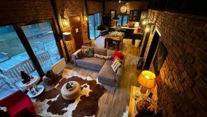 an overhead view of a living room with a brick wall at Uludag ztrk Mountain House in Kirazlı