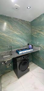 a kitchen counter with a sink and a stove at 6th october luxury studio 2 in 6th Of October +3 photos