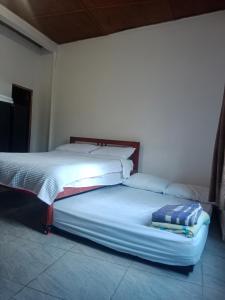 a large bed in a room with a mattress at Apartaestudio Central in Chiquinquirá