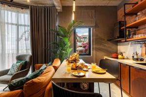 a living room with a table with food on it at Ruhigen Homestay Phan Rang in Thôn Ðông Giang