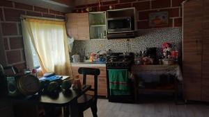 a kitchen with a stove and a counter top at villa lyda in San Vicente