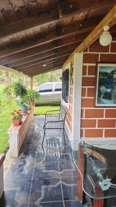 a patio with a table and a bench on a house at villa lyda in San Vicente