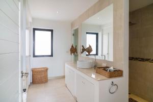 a bathroom with a sink and a mirror at Tropical Sea View 2Br Private Pool Villa in Plai Laem +23 photos