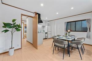 a dining room and kitchen with a table and chairs at Crystal Jade Awaza2-4F in Wada +42 photos