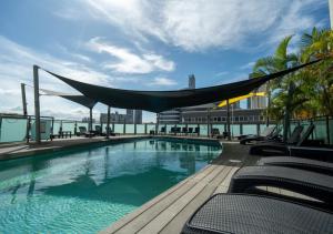 a swimming pool on the roof of a building at voco Gold Coast by IHG in Gold Coast