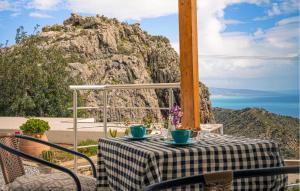 a table with two blue cups on top of a table at Daphne 2 in Agia Galini