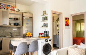 a kitchen with a washer and a washing machine at Daphne 2 in Agia Galini +11 photos