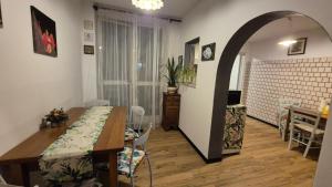 a kitchen and dining room with a table and a dining room at Apartment Trezza in Acitrezza +26 photos