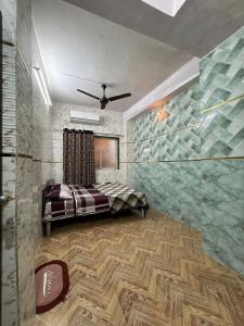 a bedroom with a bed and a glass wall at Sky cottage in Jāmb