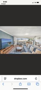 a picture of a living room with a couch and a table at 3 Mile in Lennox Head