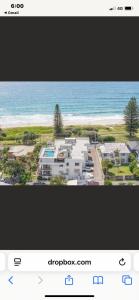 a screenshot of a picture of a house on the beach at 3 Mile in Lennox Head