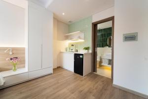 a kitchen with a sink and a counter top at Nina Sky Serviced Apartment in Ho Chi Minh City +41 photos