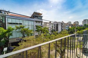 a view of the city from the balcony of a building at Nina Sky Serviced Apartment in Ho Chi Minh City
