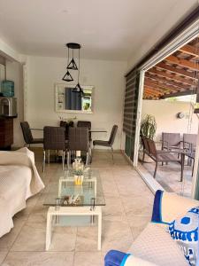 a living room with a couch and a table at Casa con terraza frente alberca in Tezoyuca