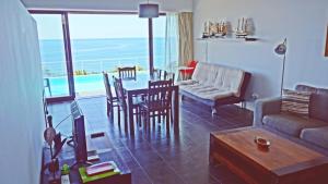 a living room with a couch and a table at QVA - Quinta Velha das Amoreiras in Vila Franca do Campo