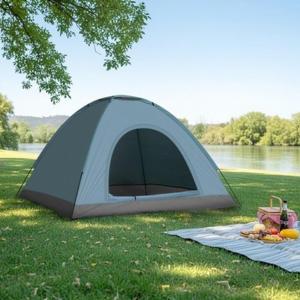 a tent sitting on the grass next to a lake at Namdong Waterfall & Eco Resort in Luang Prabang