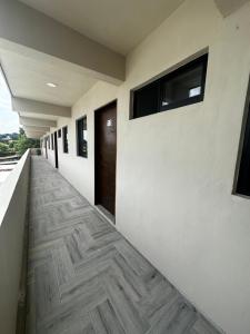 a hallway of a building with a wooden floor at Depto Vista Cañón del Sumidero in Cerro Hueco
