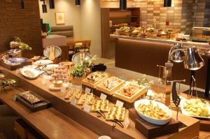 a buffet line with many different types of food at Hotel Global View Hakodate in Hakodate