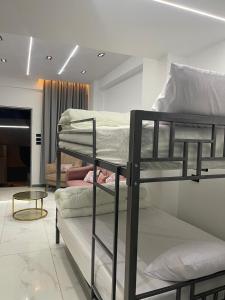 a room with two bunk beds and a table at 6th october luxury studio 2 in 6th Of October