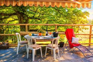 a table and chairs sitting on a patio at Ca Brunella 2 Lake Maggiore View Terrace for Four - Happy Rentals in Riazzino