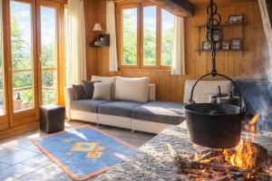 a living room with a large pot over a fire at Ca Brunella 2 Lake Maggiore View Terrace for Four - Happy Rentals in Riazzino