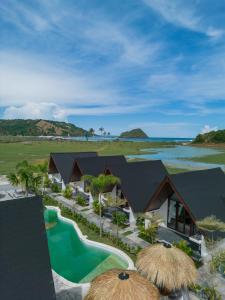an aerial view of a resort with a swimming pool at Limbo Lux Bungalows in Kuta Lombok