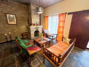 a living room with a couch and a fireplace at Pillow on the Cloud in Rāmgarh