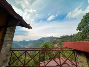 a balcony with a view of the mountains at Pillow on the Cloud in Rāmgarh