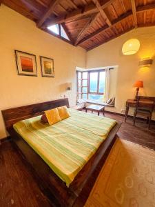 a bedroom with a large bed in a room at Pillow on the Cloud in Rāmgarh