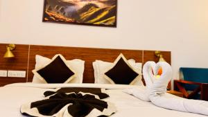 a bed with two swans made to look like swans at Skylark Holidays Chinnakanal in Chinnakanal