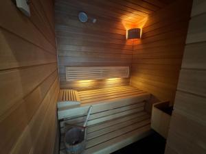 a sauna with a bench in a wooden room at Haus Titschendorf in Wurzbach