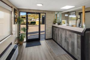 a lobby with a door leading to a patio at Rodeway Inn Ardmore I-65 in Elkton
