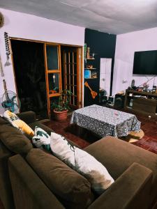 a living room with a couch and a table at Hare maohi in Hanga Roa