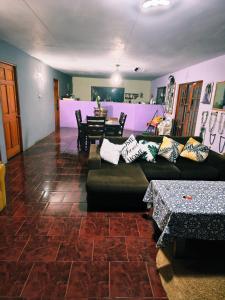 a living room with a couch and a table at Hare maohi in Hanga Roa