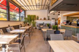 a dining room with tables and chairs in a restaurant at Pure Blanche Hotel in Antalya +44 photos
